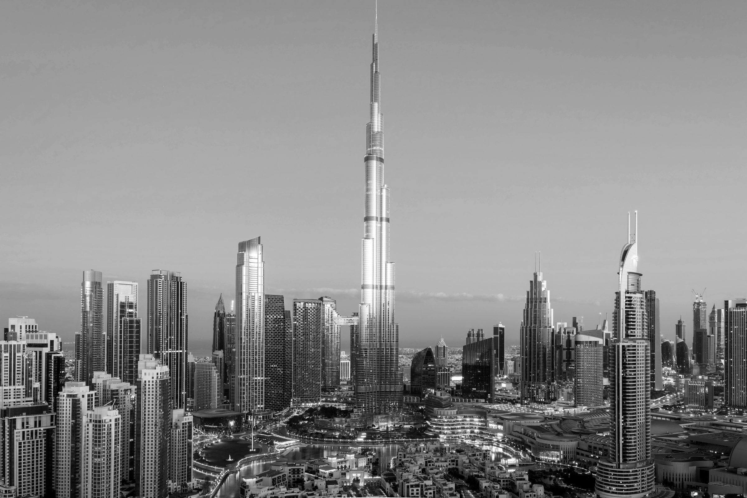 Downtown Dubai skyline at dusk, in black and white